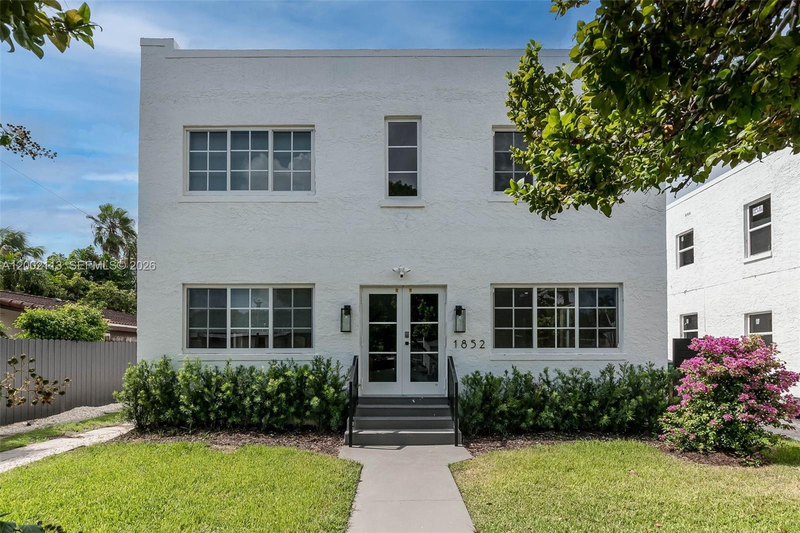 1852 Southwest 22nd Terrace, Unit 2 Miami, FL 33145 - Photo 16 of 20 a front view of a house with garden