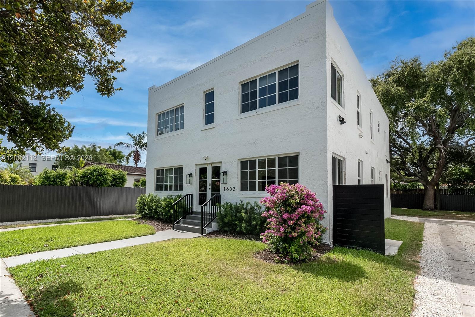 1852 Southwest 22nd Terrace, Unit 2 Miami, FL 33145 - Photo 17 of 20 a front view of a house with garden