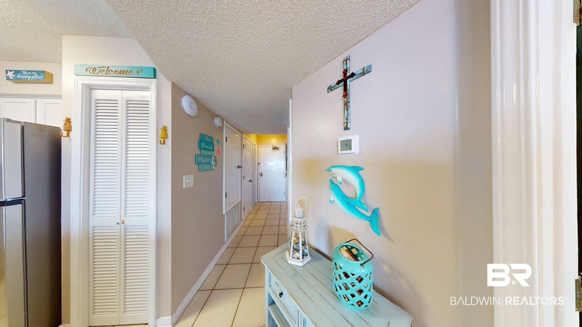 645 Plantation Road, Unit 6503 Gulf Shores, AL 36542 - Photo 43 of 53 Hall featuring a textured ceiling and light tile patterned floors