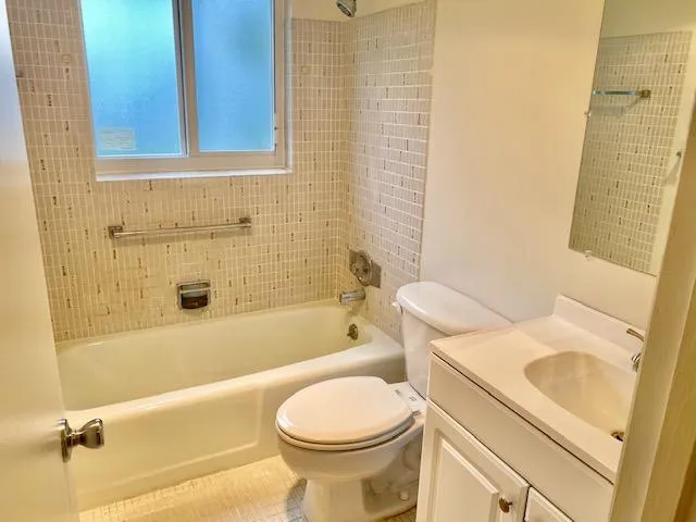 a bathroom with a sink toilet and bathtub