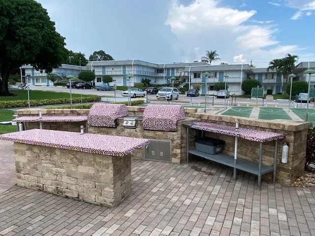 a view of a swimming pool with a patio