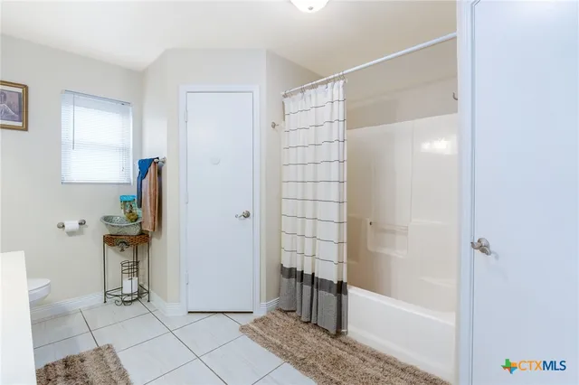 a bathroom with a sink double vanity and a mirror