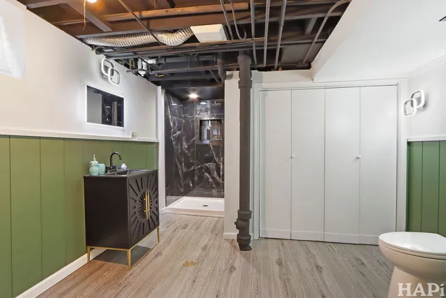 a view of an entryway with wooden floor