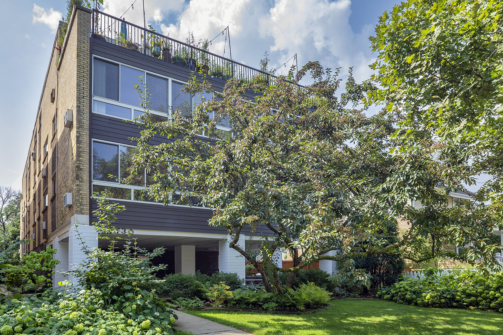 2730 Central Street, Unit 3A Evanston, IL 60201 - Photo 1 of 18 a view of a yard in front of a building