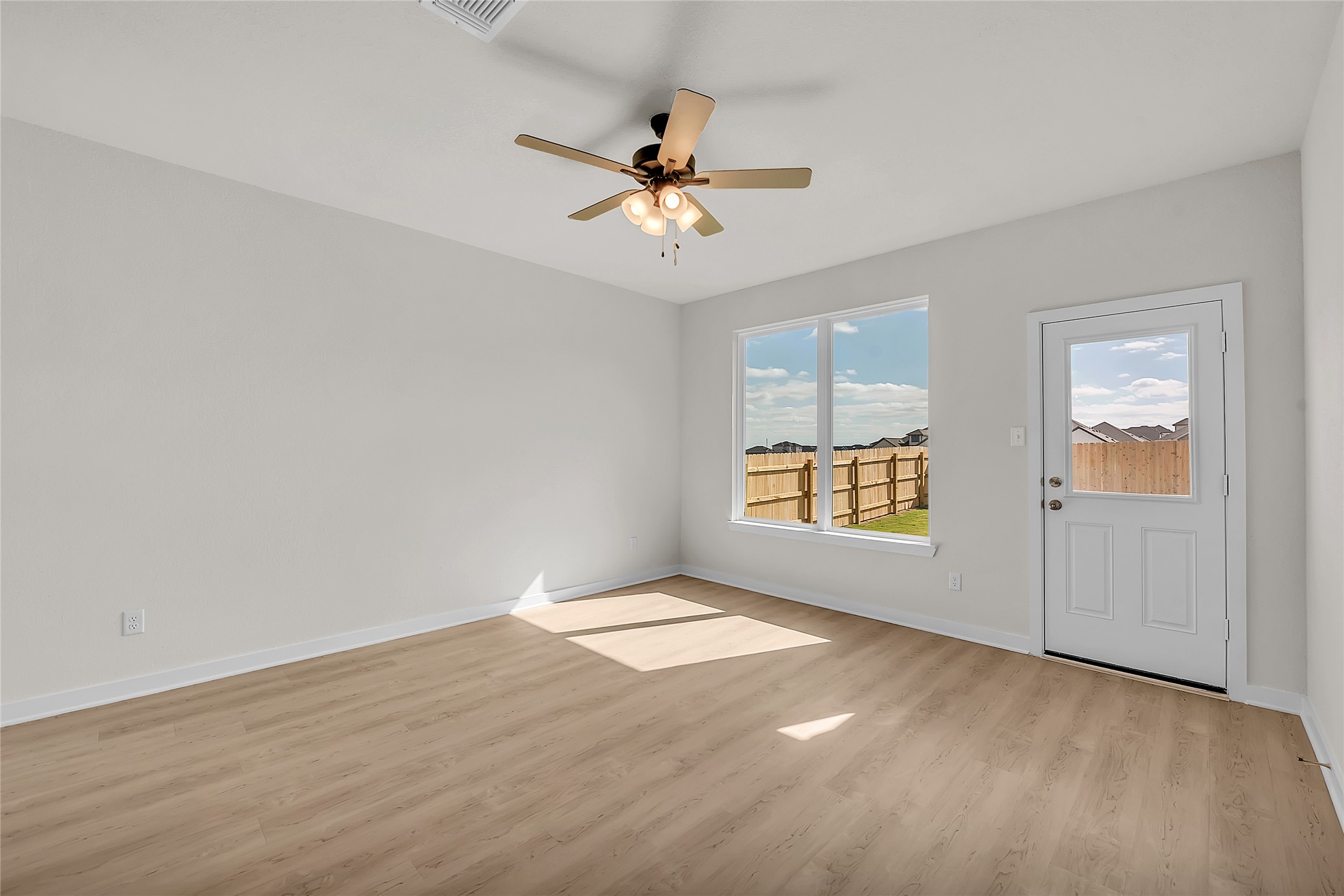 308 Boatright Boulevard Jarrell, TX 76537 - Photo 16 of 31 Empty room with light wood-style flooring and a ceiling fan