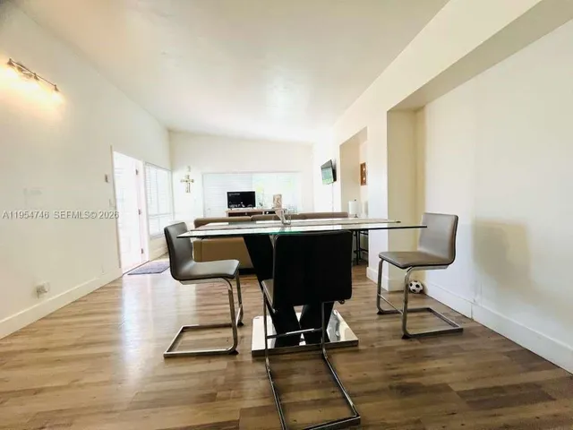 a view of a workspace with furniture and lounge chair