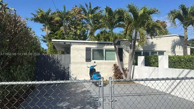 a house with a tree in front of it