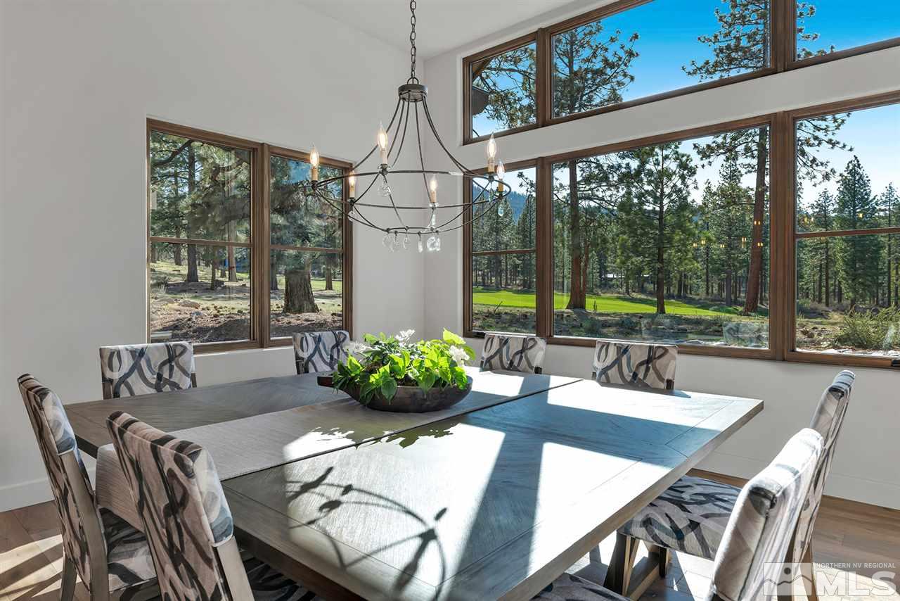 249 Mill Race Loop Carson City, NV 89705 - Photo 13 of 40 a dining room with furniture a chandelier and wooden floor