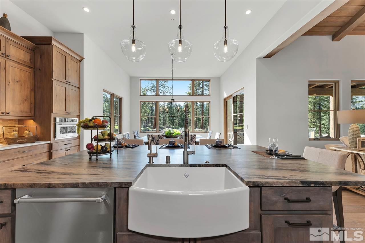 249 Mill Race Loop Carson City, NV 89705 - Photo 15 of 40 a kitchen with a sink a counter space dining table and chairs
