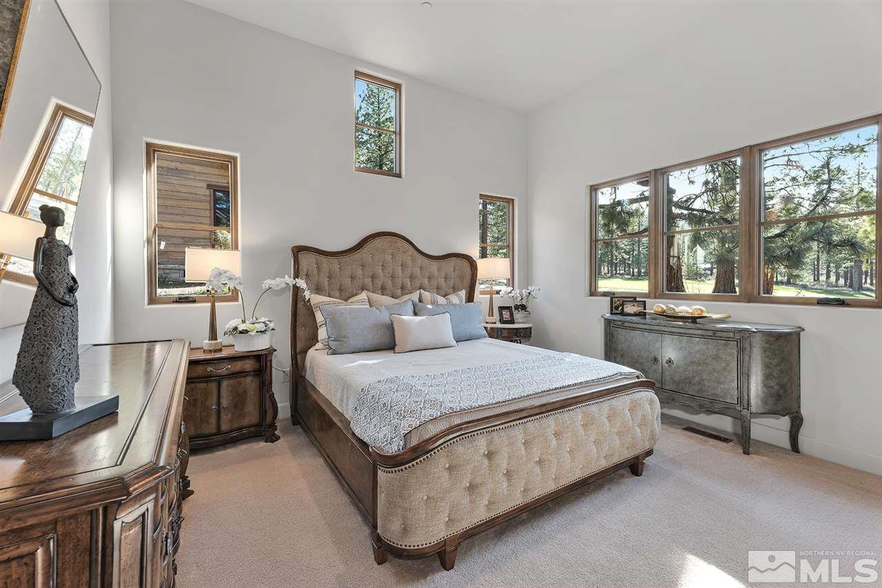 249 Mill Race Loop Carson City, NV 89705 - Photo 23 of 40 a bedroom with a bed and a large window
