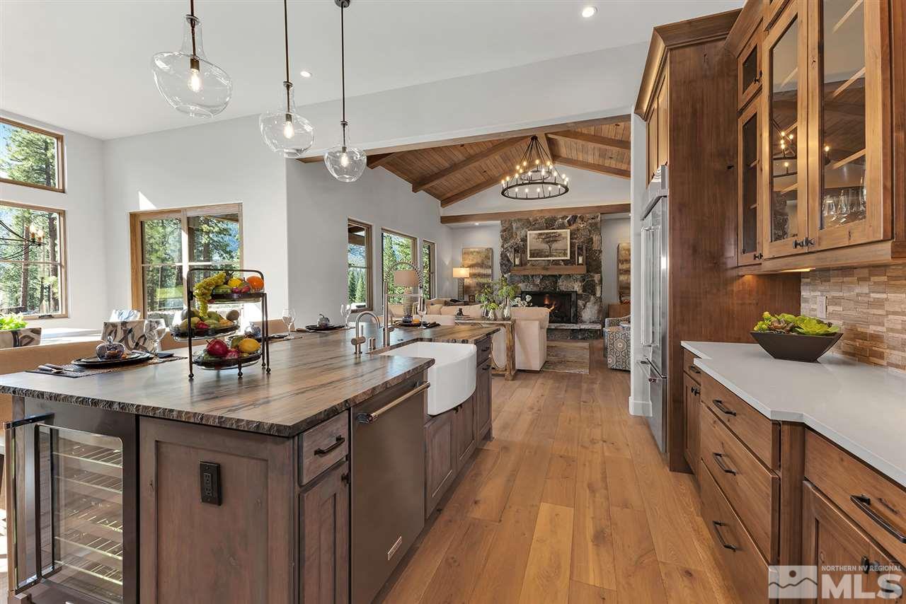 249 Mill Race Loop Carson City, NV 89705 - Photo 10 of 40 a kitchen with kitchen island granite countertop a sink stove and cabinets