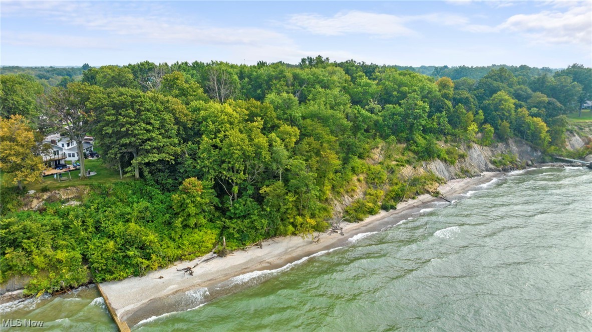3337 Lake Road West Ashtabula, OH 44004 - Photo 8 of 15 Drone / aerial view of a large body of water and a heavily wooded area