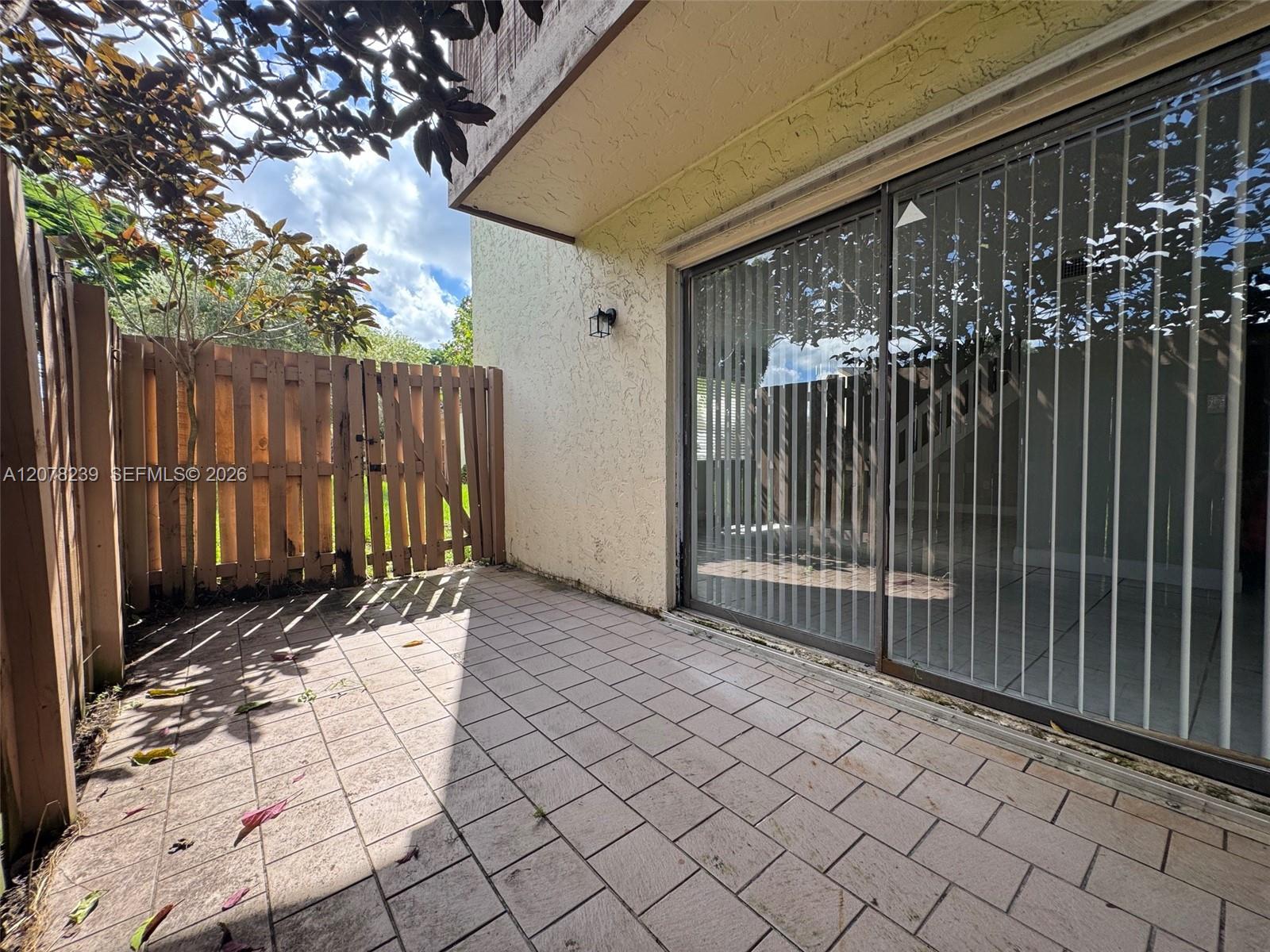 11467 Southwest 109th Road, Unit 7B Miami, FL 33176 - Photo 22 of 45 Side Patio