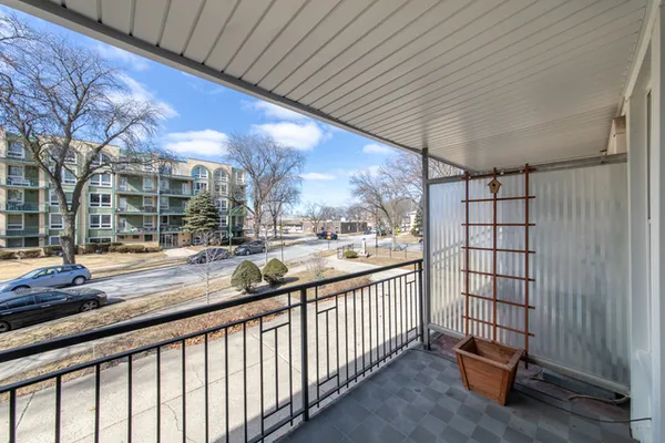 a view of a living room and a balcony