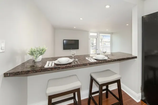 a kitchen with a table and chairs in it