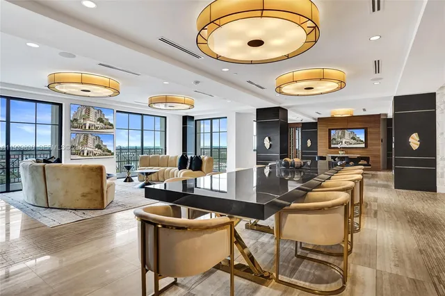 a view of a dining room with furniture wooden floor and a rug