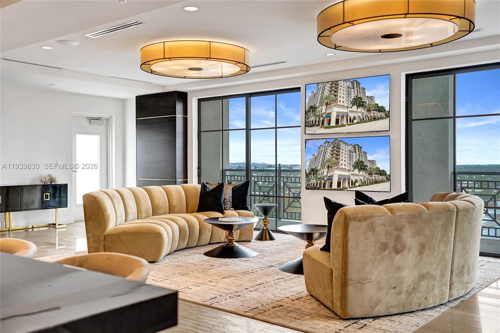 101 East Camino Real, Unit PH07 Boca Raton, FL 33432 - Photo 17 of 43 a living room with furniture and a large window