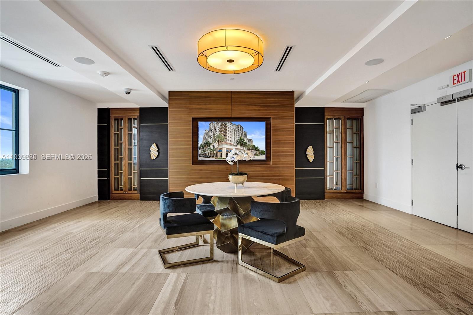 101 East Camino Real, Unit PH07 Boca Raton, FL 33432 - Photo 21 of 43 a dining room with a table and chairs