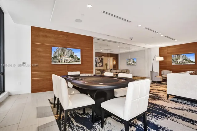 a living room with fireplace furniture and a flat screen tv