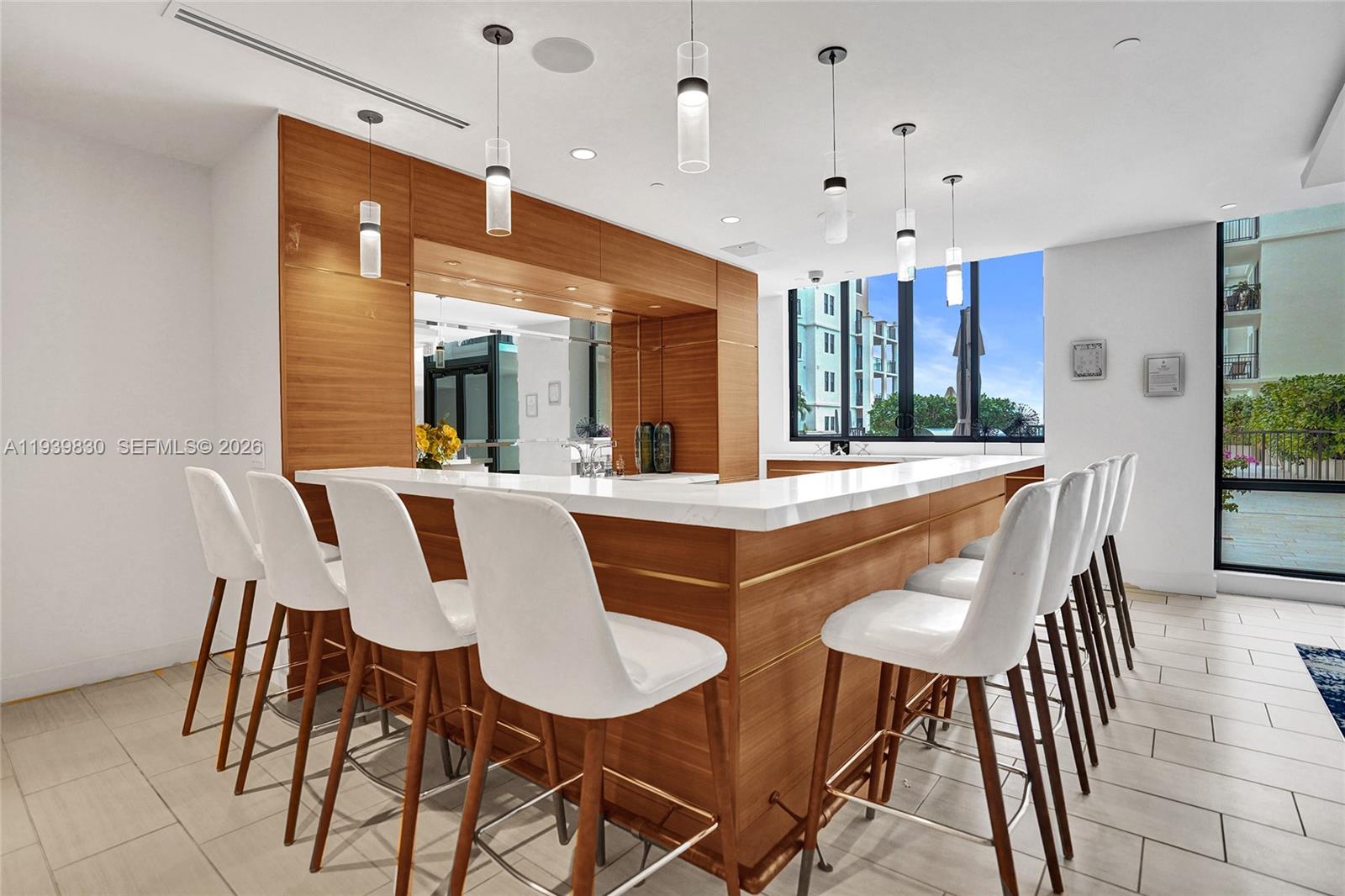 101 East Camino Real, Unit PH07 Boca Raton, FL 33432 - Photo 30 of 43 a dining room with furniture and window
