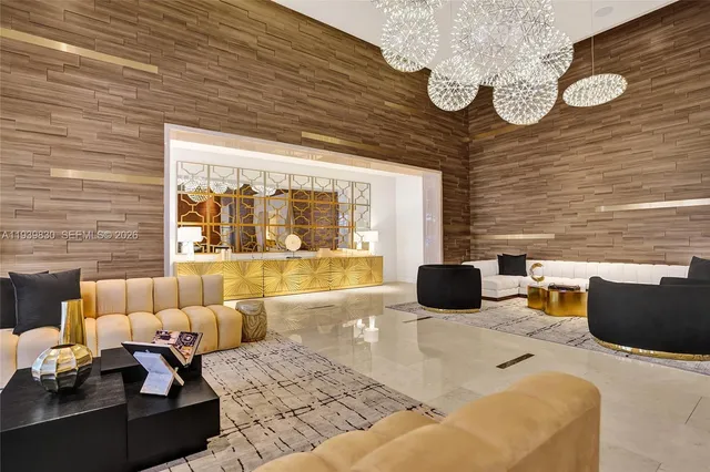 a living room with furniture and a large window