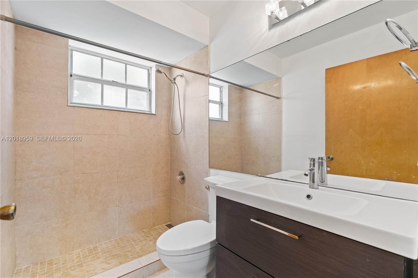 15345 Southwest 63rd Terrace Miami, FL 33193 - Photo 25 of 51 a bathroom with a sink a toilet and shower