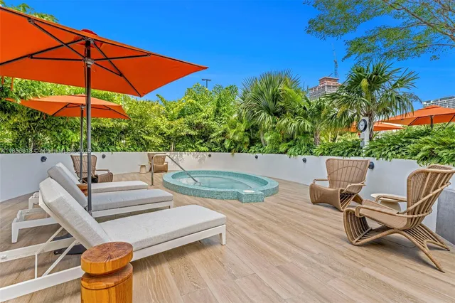 a building with pool table and chairs
