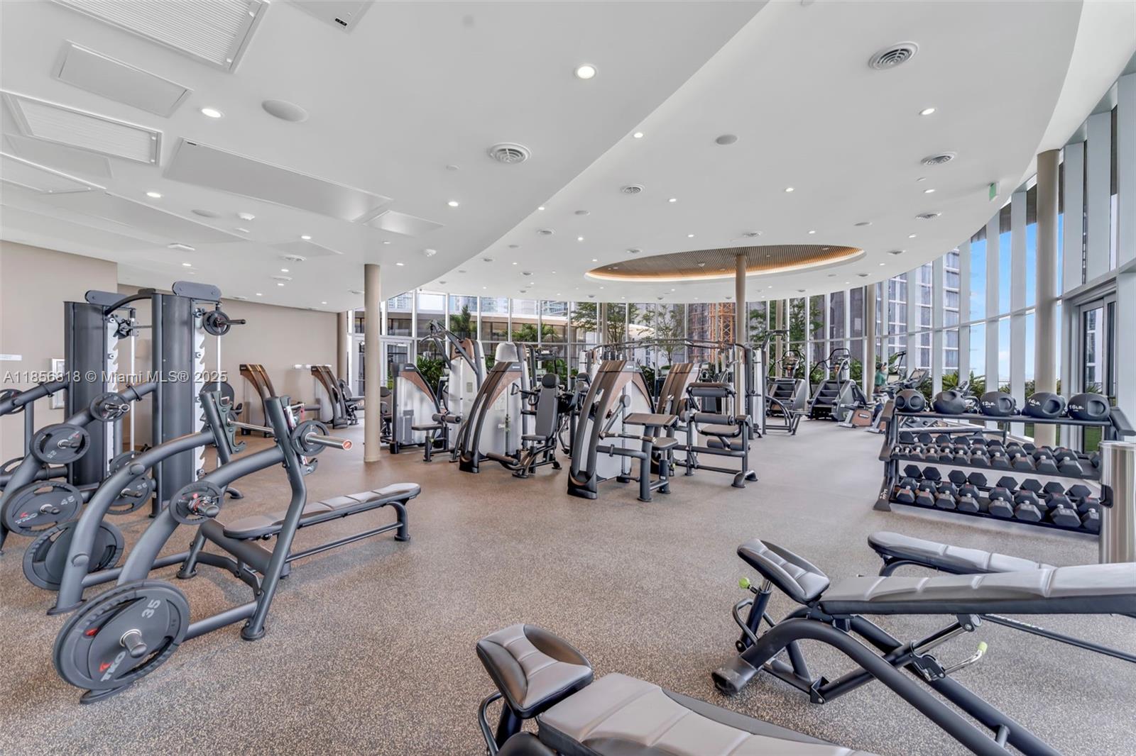 700 Northeast 24th Street, Unit 2002 Miami, FL 33137 - Photo 28 of 36 a view of a room with gym equipment