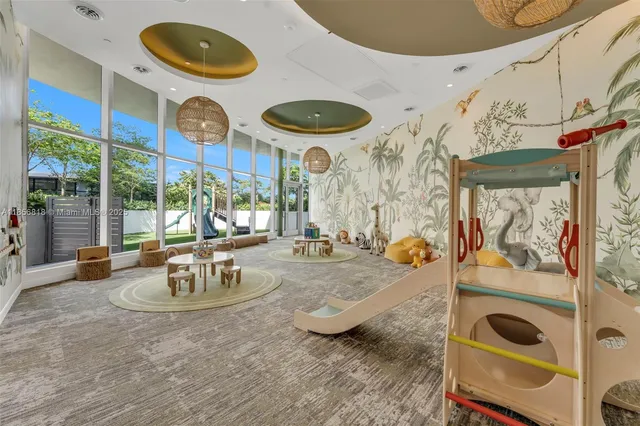 a balcony with table and chairs