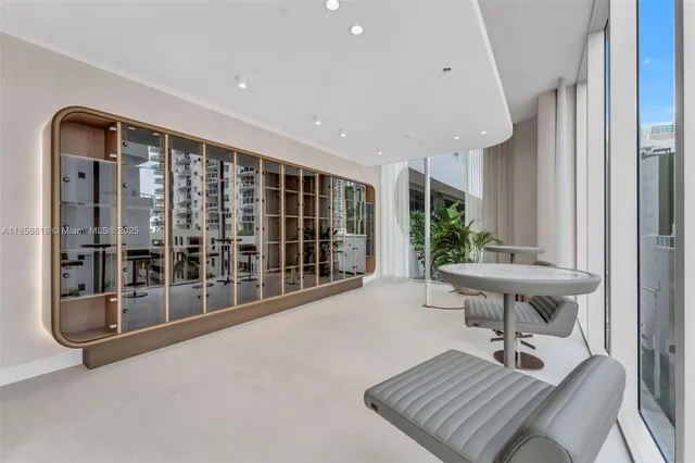 a view of an entryway with table and chairs