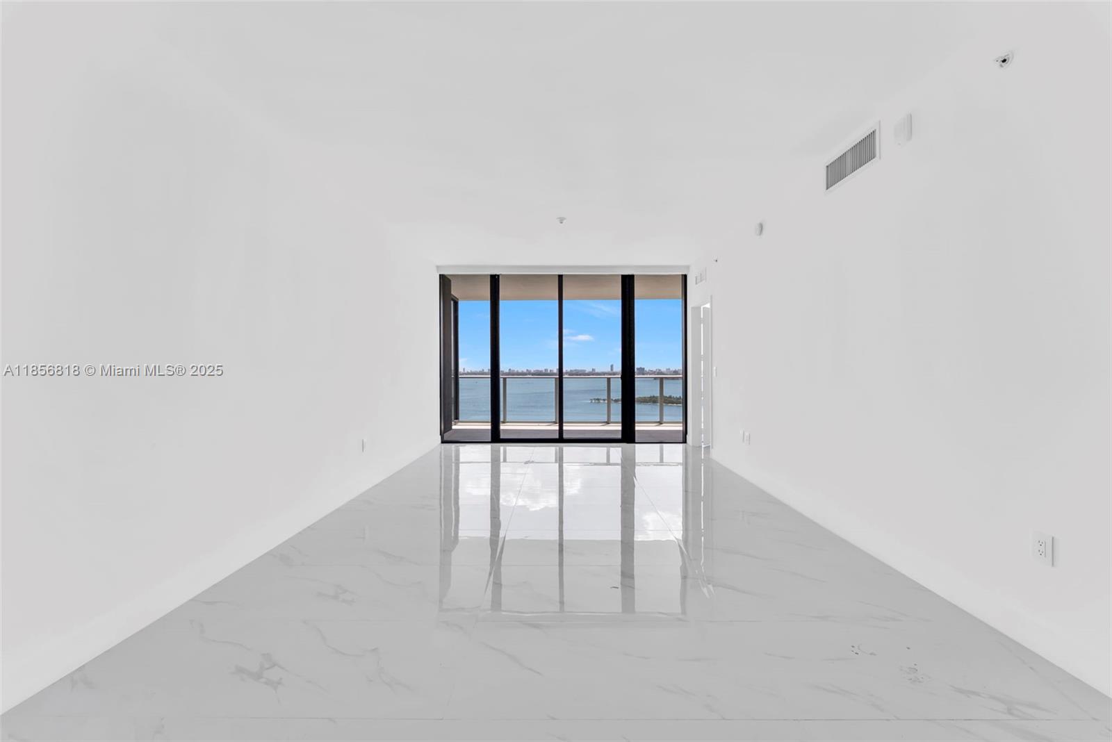 700 Northeast 24th Street, Unit 2002 Miami, FL 33137 - Photo 3 of 36 a view of an empty room with a window