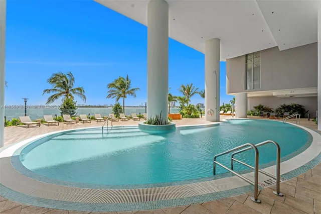 a view of a swimming pool with a patio