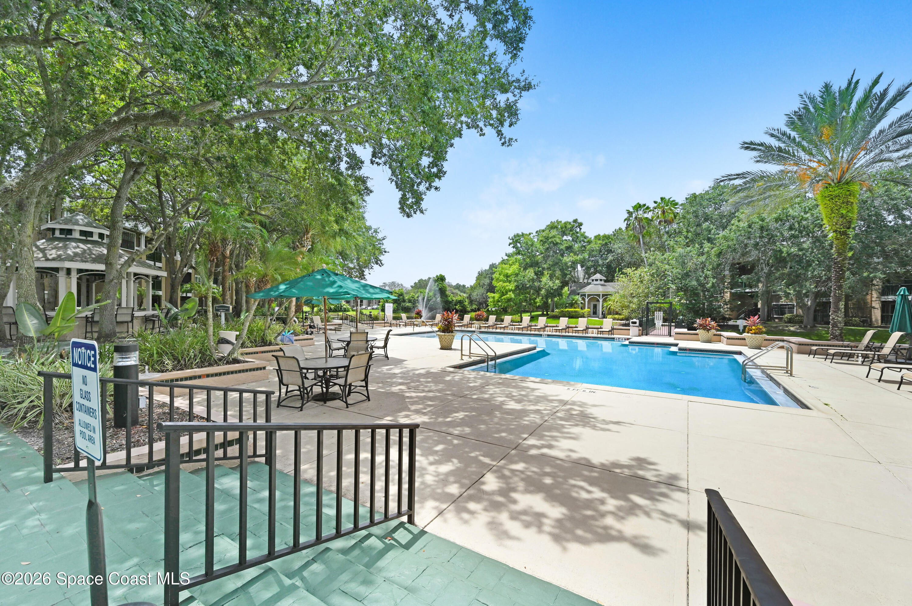 7667 North Wickham Road, Unit 1309 Melbourne, FL 32940 - Photo 16 of 21 a view of a swimming pool with a patio