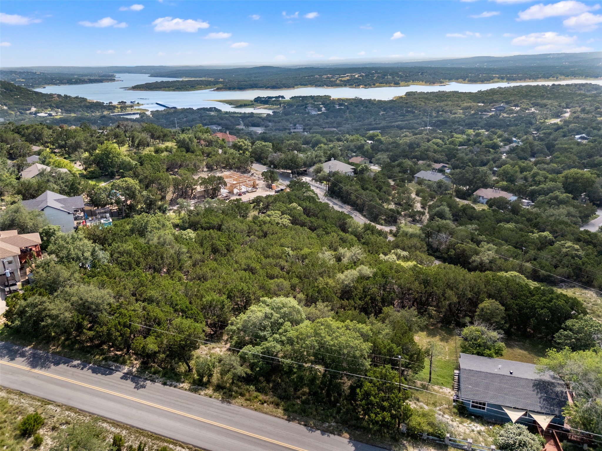 21105 Ridgeview Road Lago Vista, TX 78645 - Photo 4 of 34 Discover expansive natural surroundings with distant lake views.
