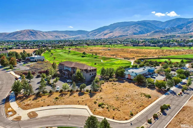 a view of a city with mountains in the background