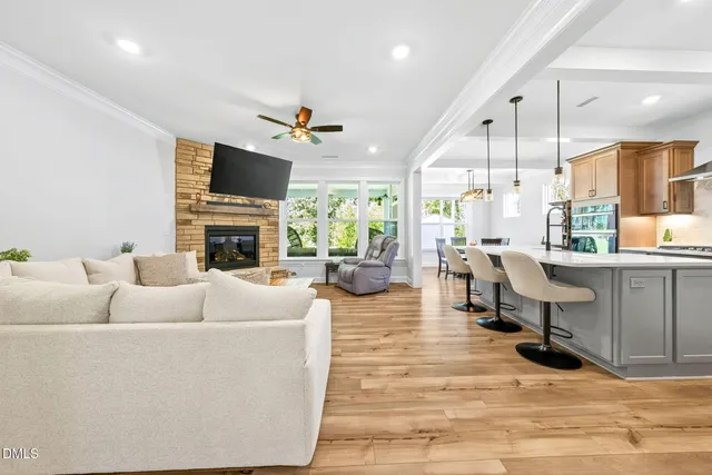 a living room with furniture fireplace and a flat screen tv