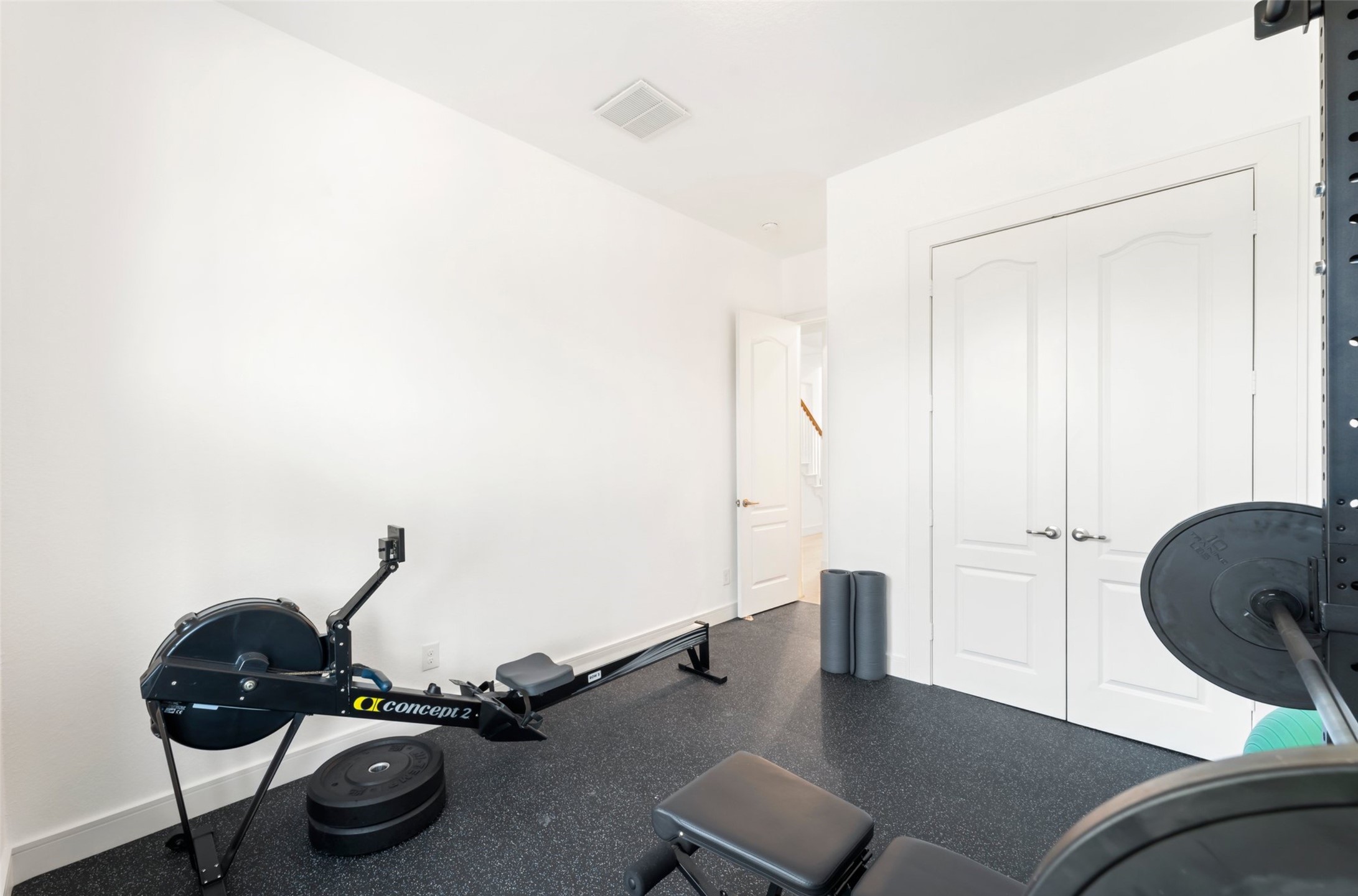 1053 Bat Hawk Court Conroe, TX 77385 - Photo 34 of 50 a room with gym equipment