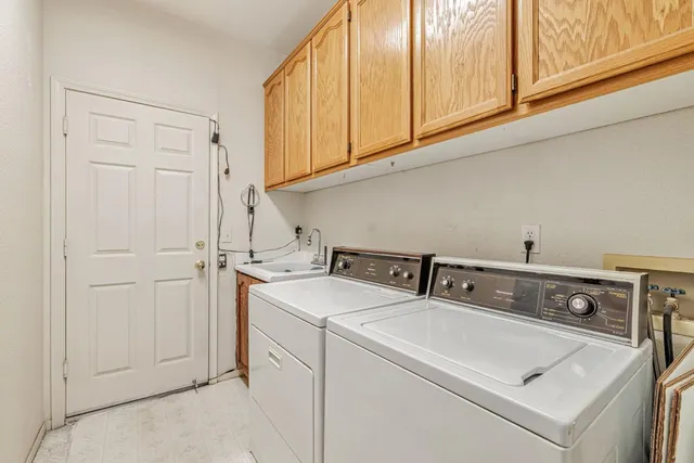 a view of backyard with deck and outdoor seating