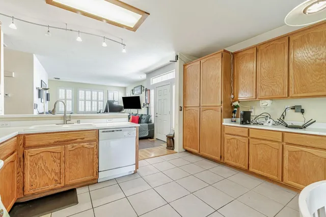 a kitchen with a sink cabinets and appliances