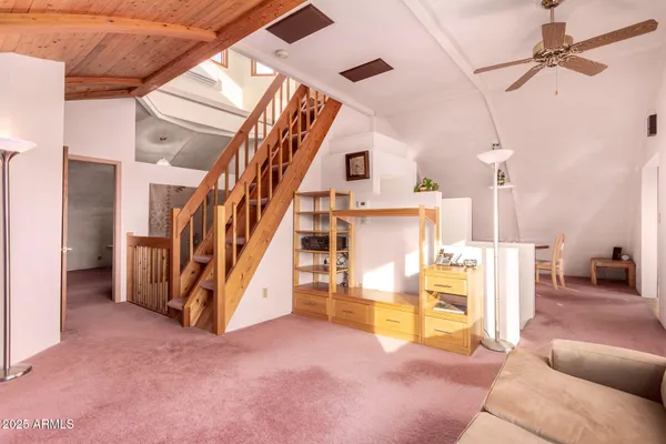 a view of a living room with a large window