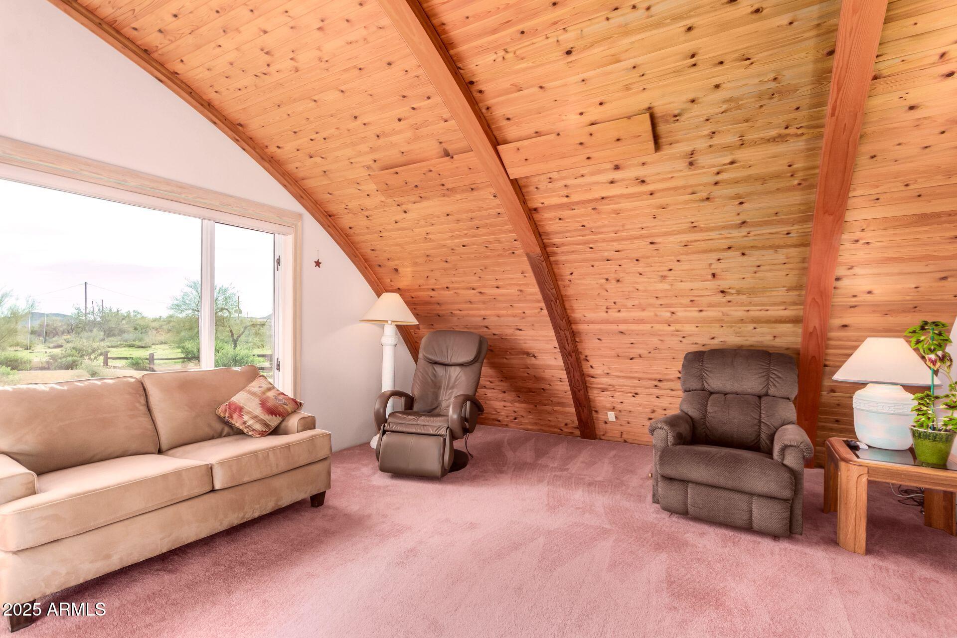 412 West Joy Ranch Road Phoenix, AZ 85086 - Photo 16 of 71 a living room with furniture and a floor to ceiling window
