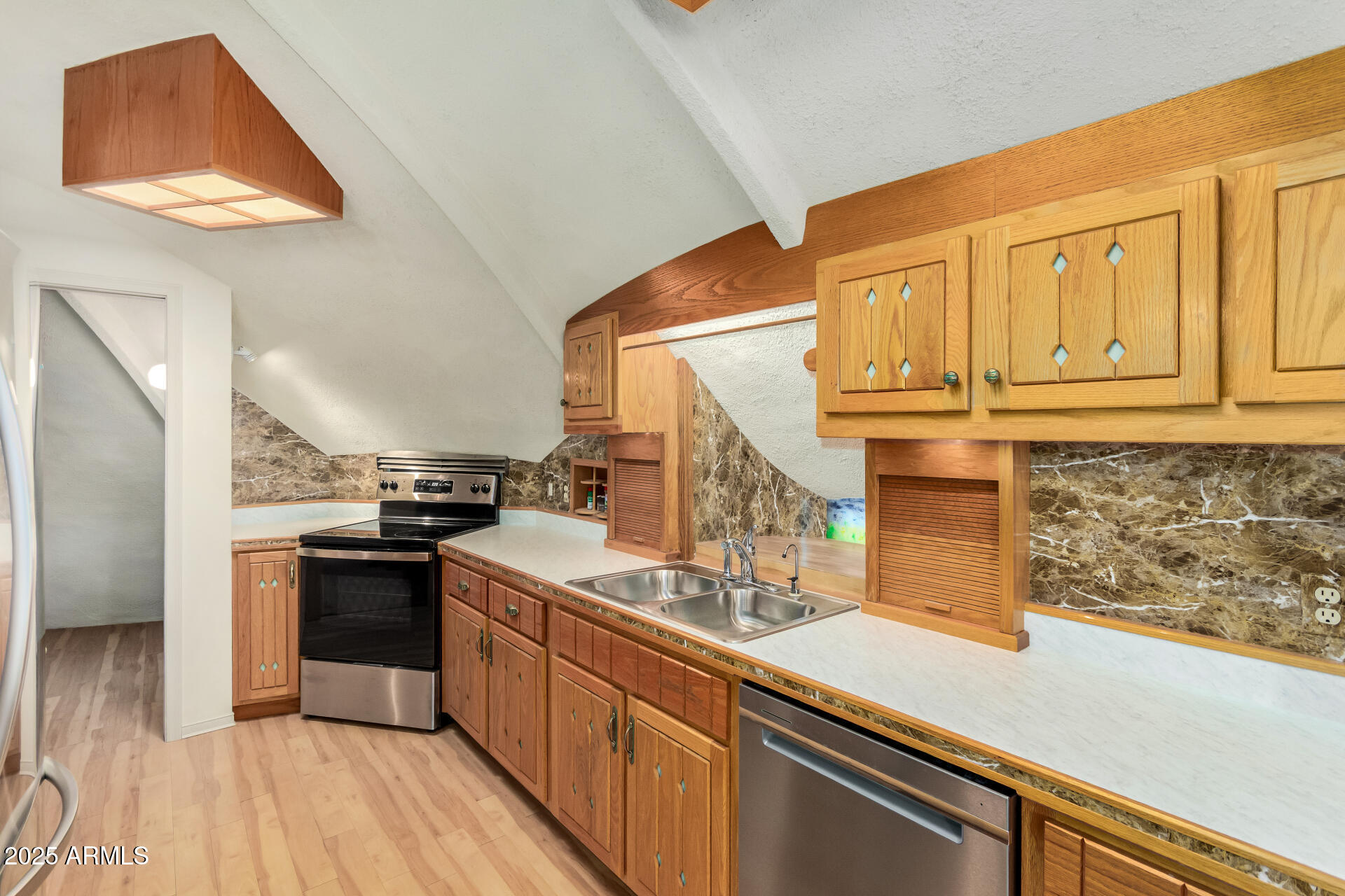 412 West Joy Ranch Road Phoenix, AZ 85086 - Photo 21 of 71 a kitchen with stainless steel appliances granite countertop a sink and a stove