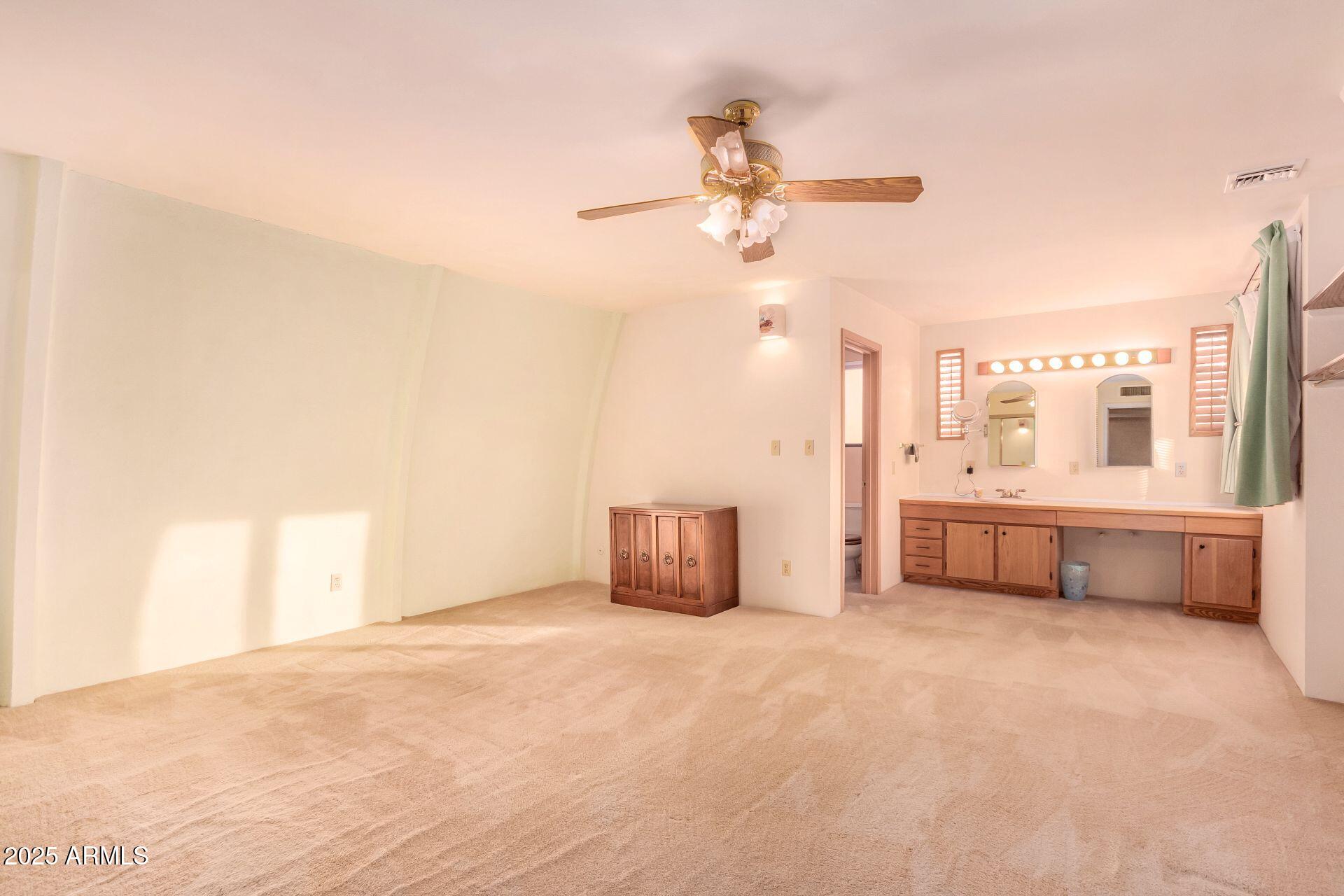 412 West Joy Ranch Road Phoenix, AZ 85086 - Photo 24 of 71 a living room with furniture and a ceiling fan