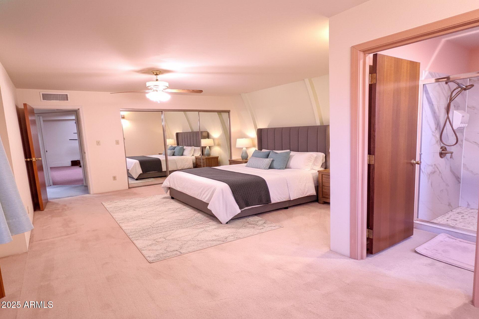 412 West Joy Ranch Road Phoenix, AZ 85086 - Photo 25 of 71 a bedroom with a bed and closet with mirror