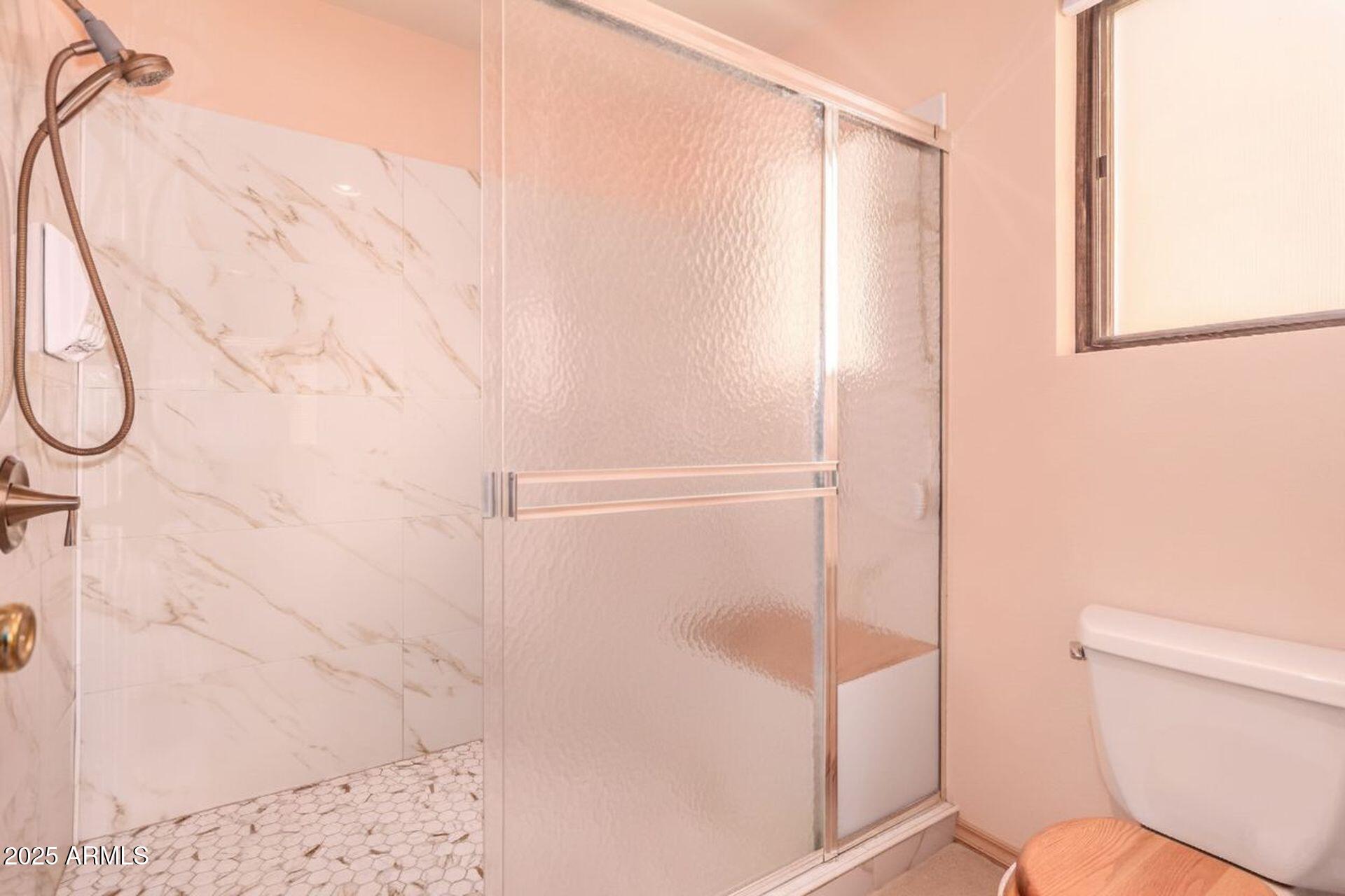 412 West Joy Ranch Road Phoenix, AZ 85086 - Photo 30 of 71 a bathroom with a shower and toilet