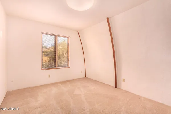 a furnished livingroom with a large window