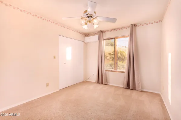 a room with furniture and view of chandelier