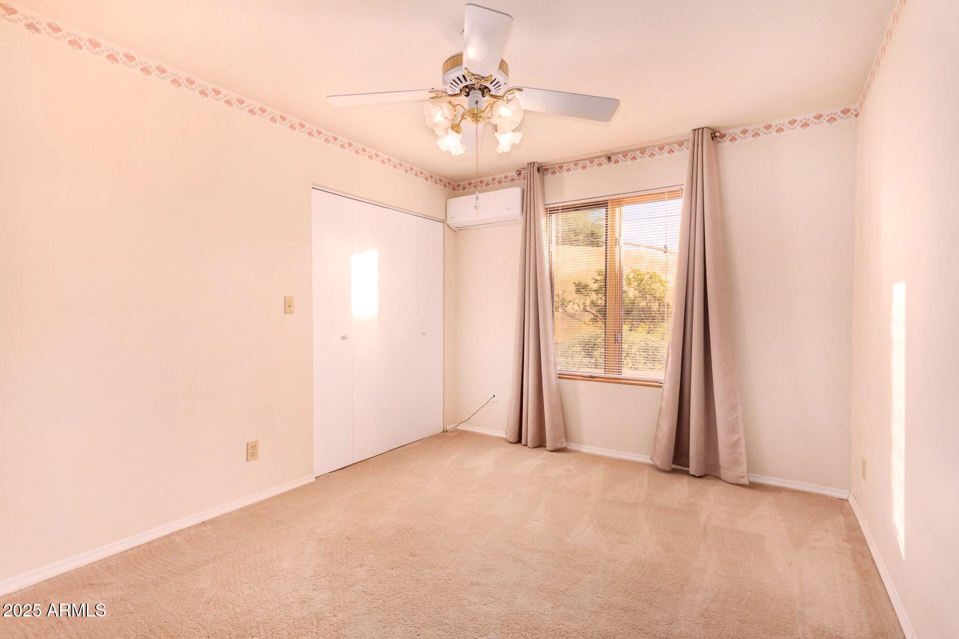 412 West Joy Ranch Road Phoenix, AZ 85086 - Photo 35 of 71 a view of an empty room with a window