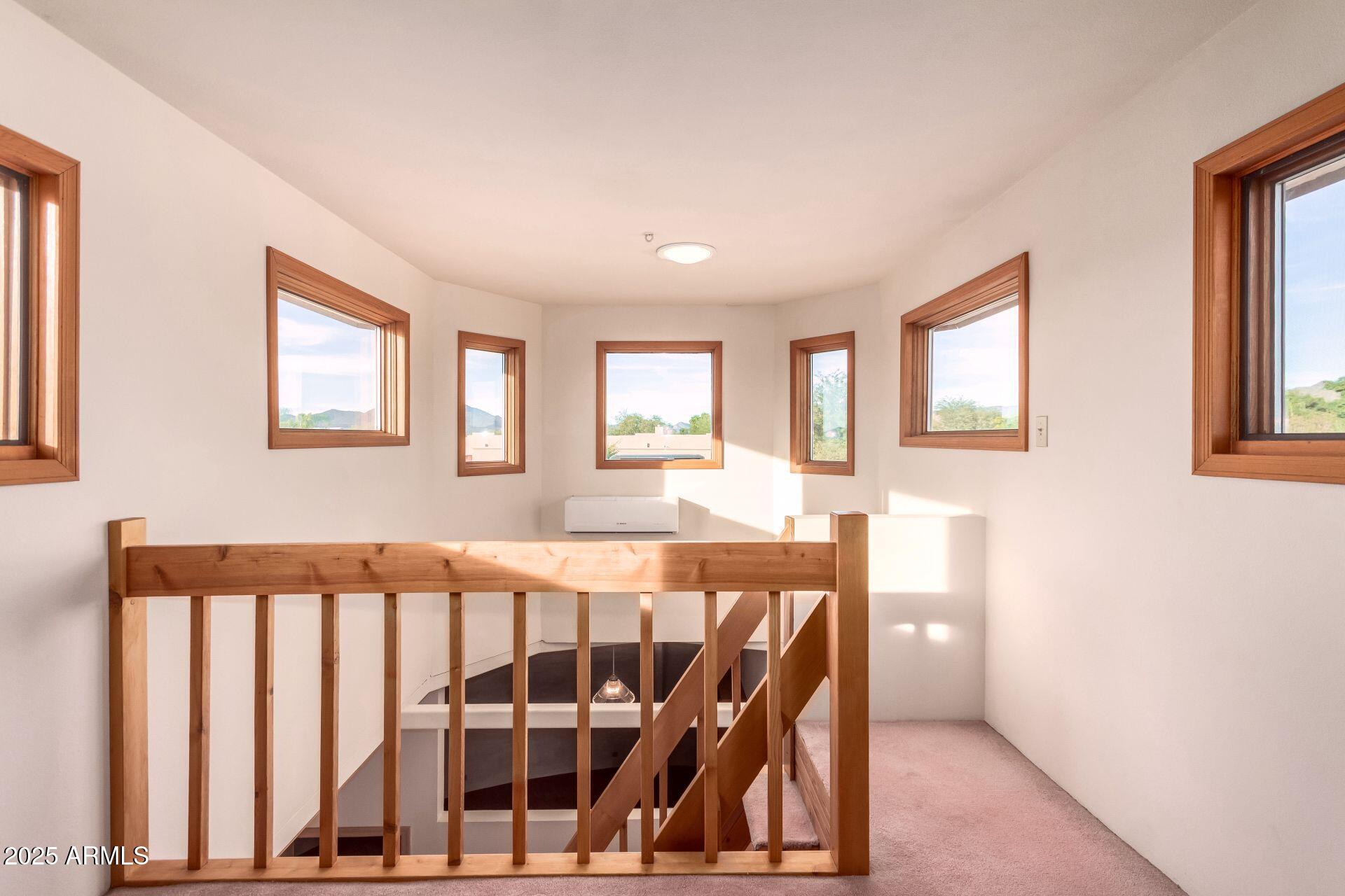 412 West Joy Ranch Road Phoenix, AZ 85086 - Photo 45 of 71 a view of a bedroom with wooden floor and windows