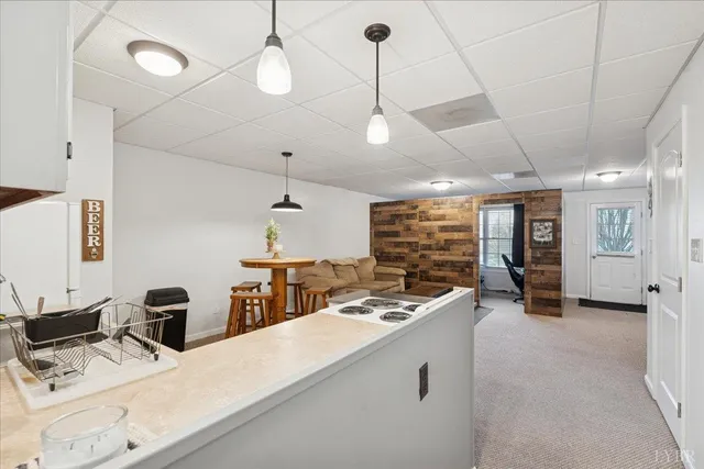 a kitchen with cabinets and window